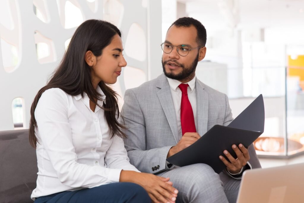 Insurance and investment agent explaining a plan to a client