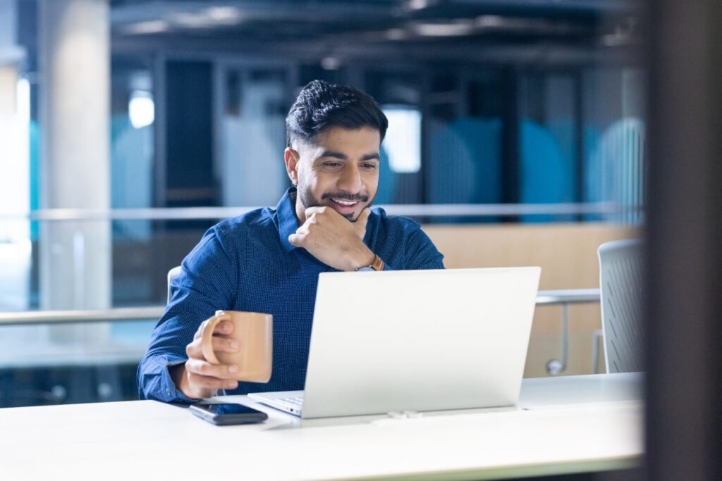 Mutual fund distributor working at his desk