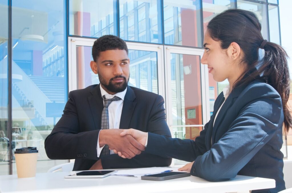 Advisor shaking hands with a client